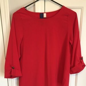 Red blouse with cuffed sleeves